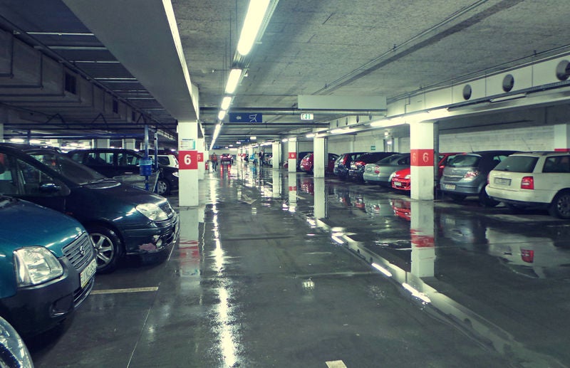 Wet parking garage with puddles