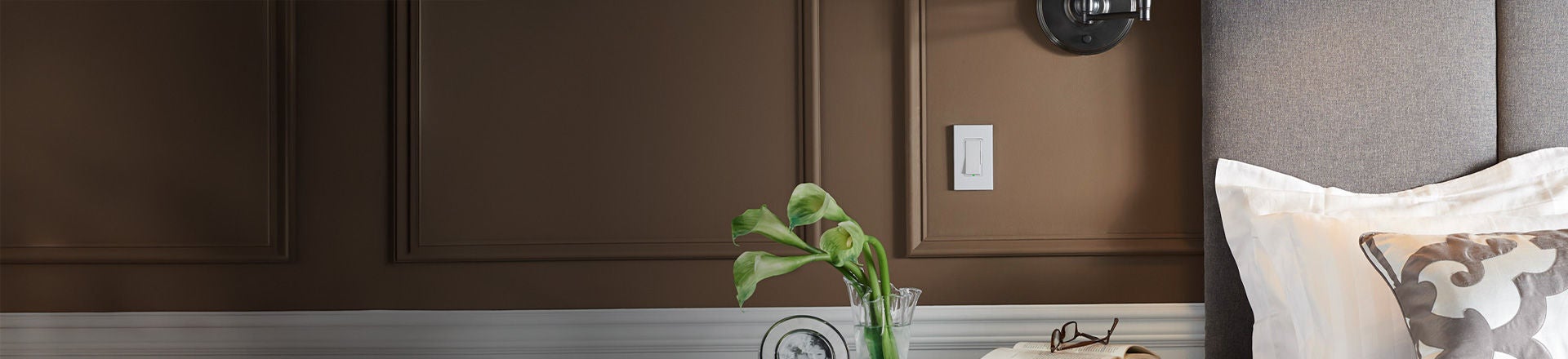 brown walled bedroom showcasing Leviton Decora Slide Dimmer
