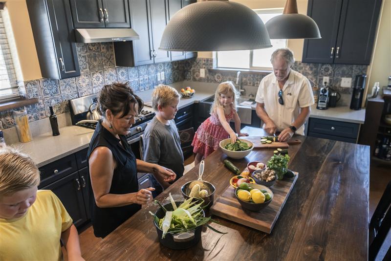 Family cooking in kitchen