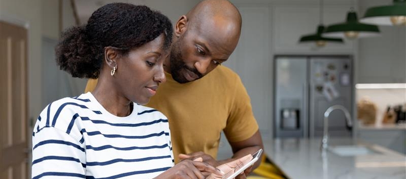 Man and Woman looking at phone together