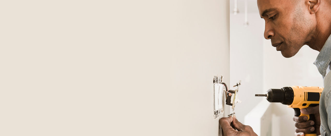 Person Installing leviton Dimmer