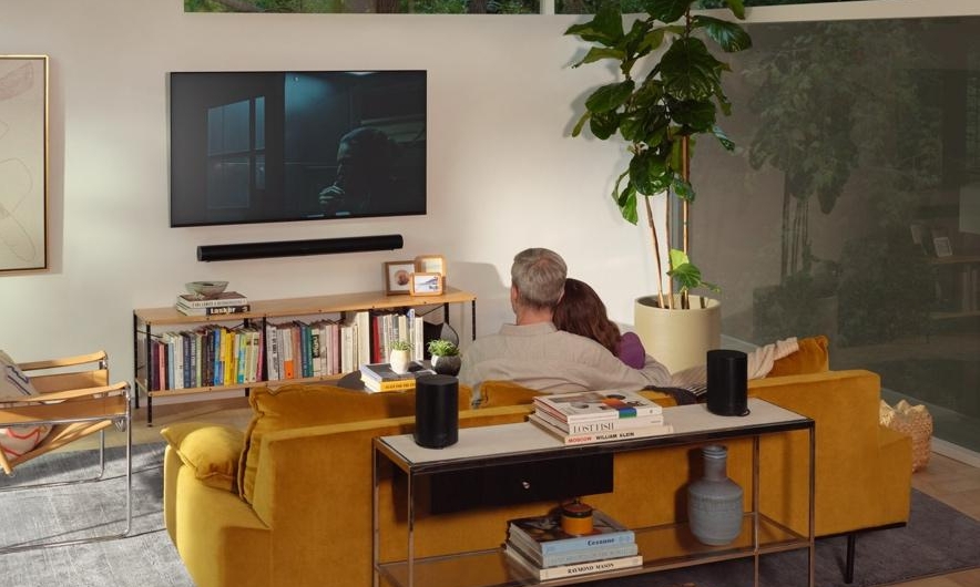 Couple relaxing on sofa together